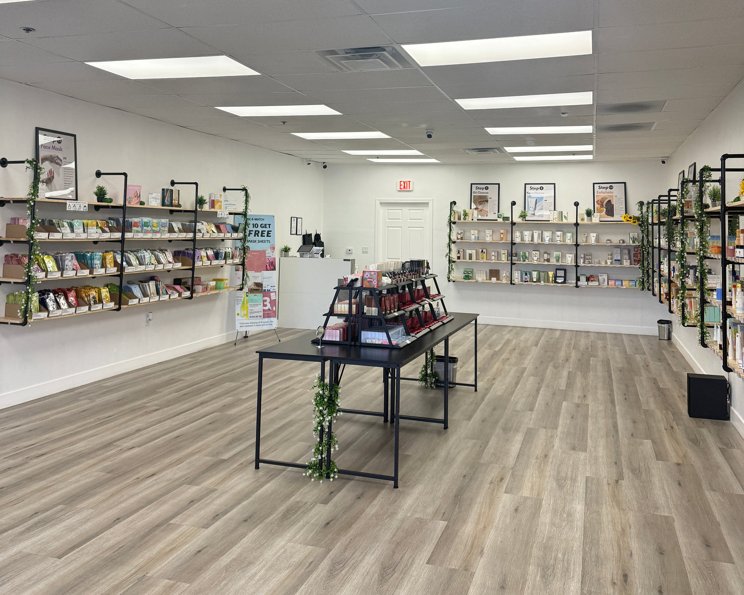 Modern interior with bookshelves lining a hallway in a building.